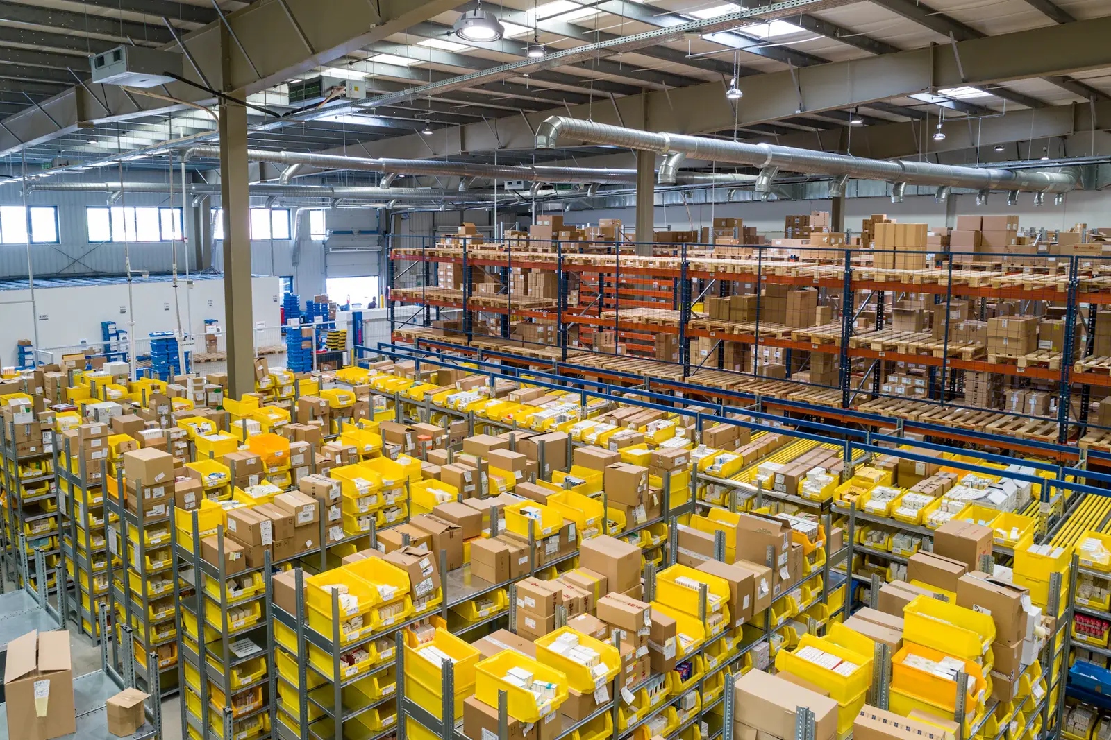 A large, well-organised warehouse aisle